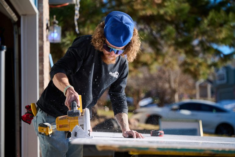 MyBath Colorado contractor cutting a wall for a new shower renovation