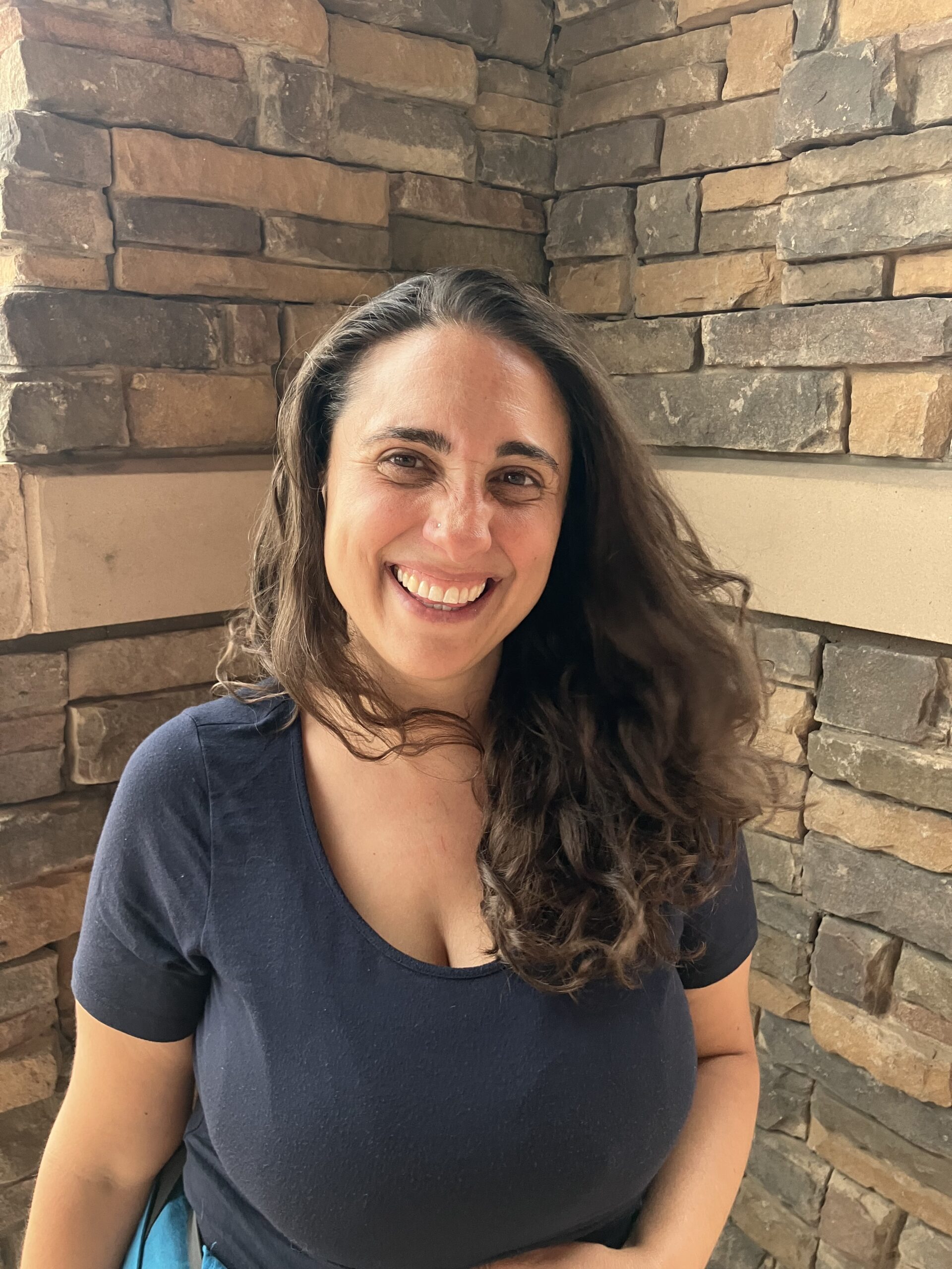 Headshot of MyBath Colorado Professional bathroom and kitchen designer, and expert reviewer, Arielle