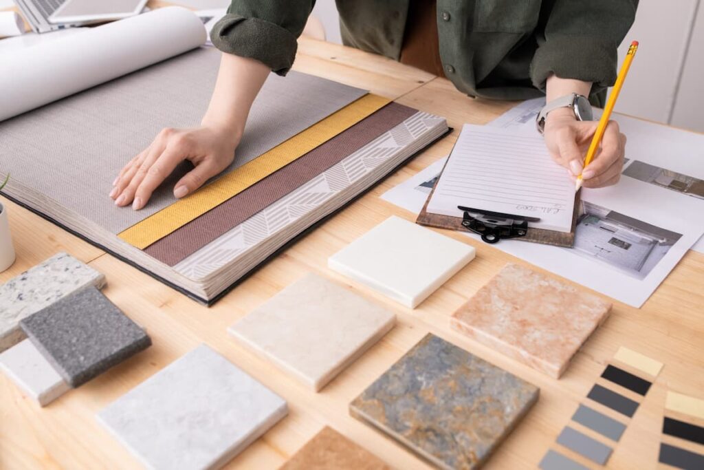 hands of a MyBath Colorado kitchen and bath designer making notes at a free in-home design consultation