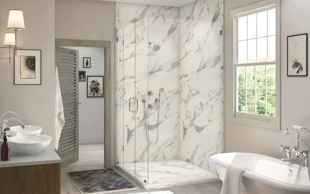 Composite walls with marble look and frameless glass doors in a shower